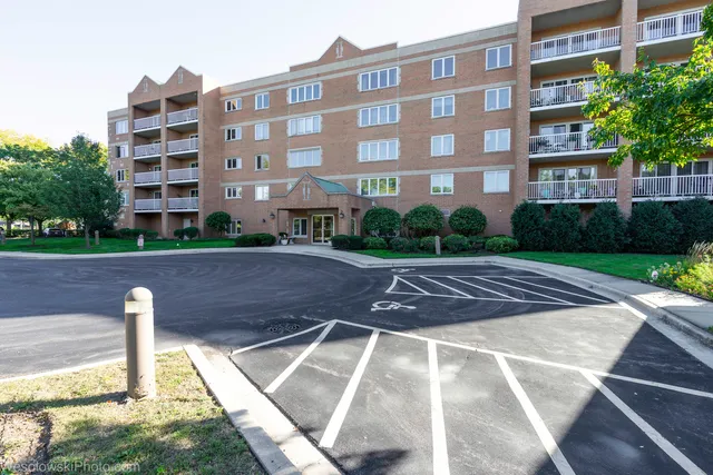 a view of a building with a yard