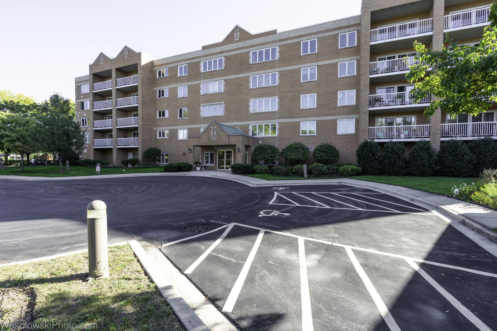 7450 Waukegan Road, Unit 206 Niles, IL 60714 - Photo 3 of 26 a view of a building with a yard