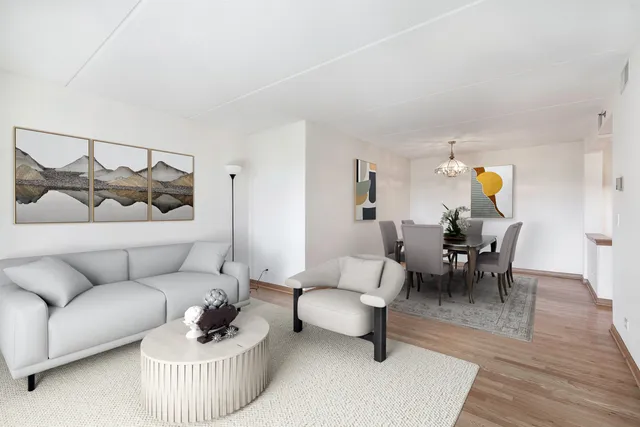 a living room with furniture and a lamp