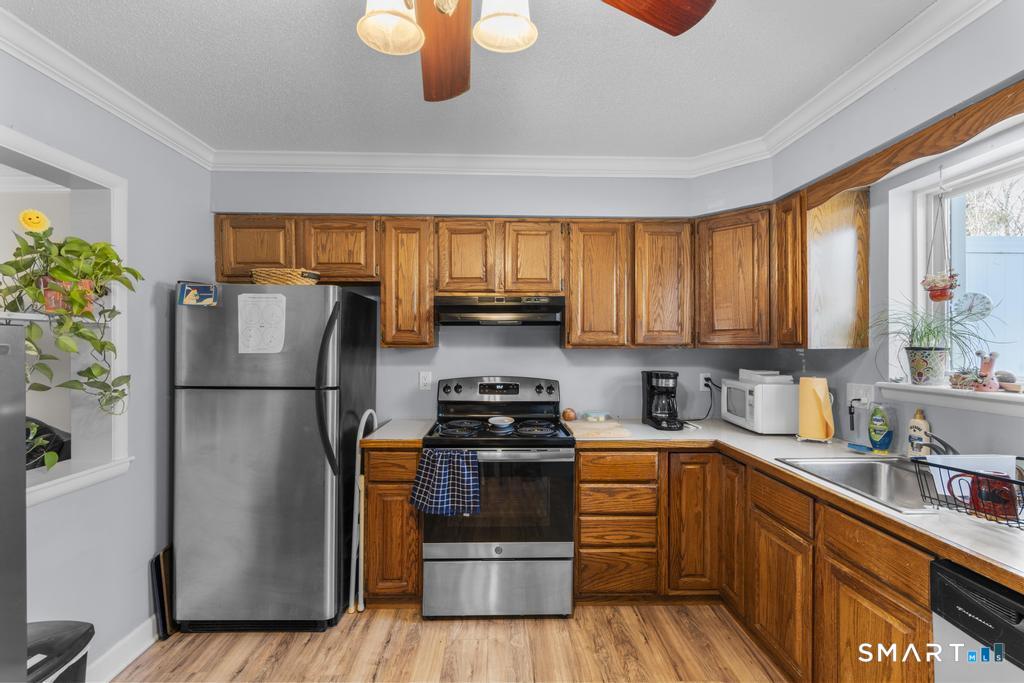 3 MacIntosh Lane, Unit 3 Ansonia, CT 06401 - Photo 13 of 34 a kitchen with a refrigerator sink and stove