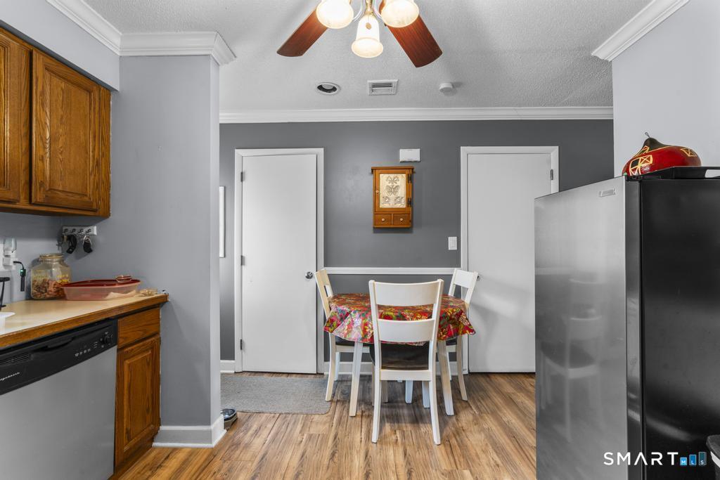 3 MacIntosh Lane, Unit 3 Ansonia, CT 06401 - Photo 16 of 34 a table and chairs in a kitchen