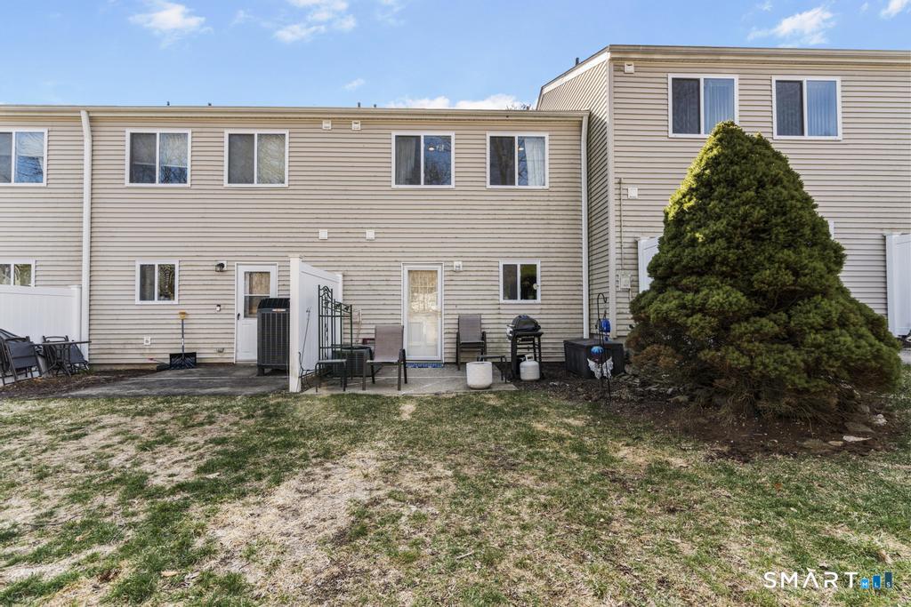 3 MacIntosh Lane, Unit 3 Ansonia, CT 06401 - Photo 31 of 34 a view of a house with backyard and sitting area