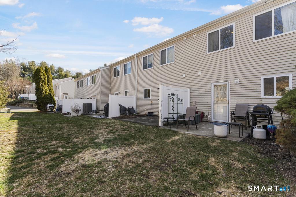 3 MacIntosh Lane, Unit 3 Ansonia, CT 06401 - Photo 32 of 34 a view of a house with backyard and sitting area
