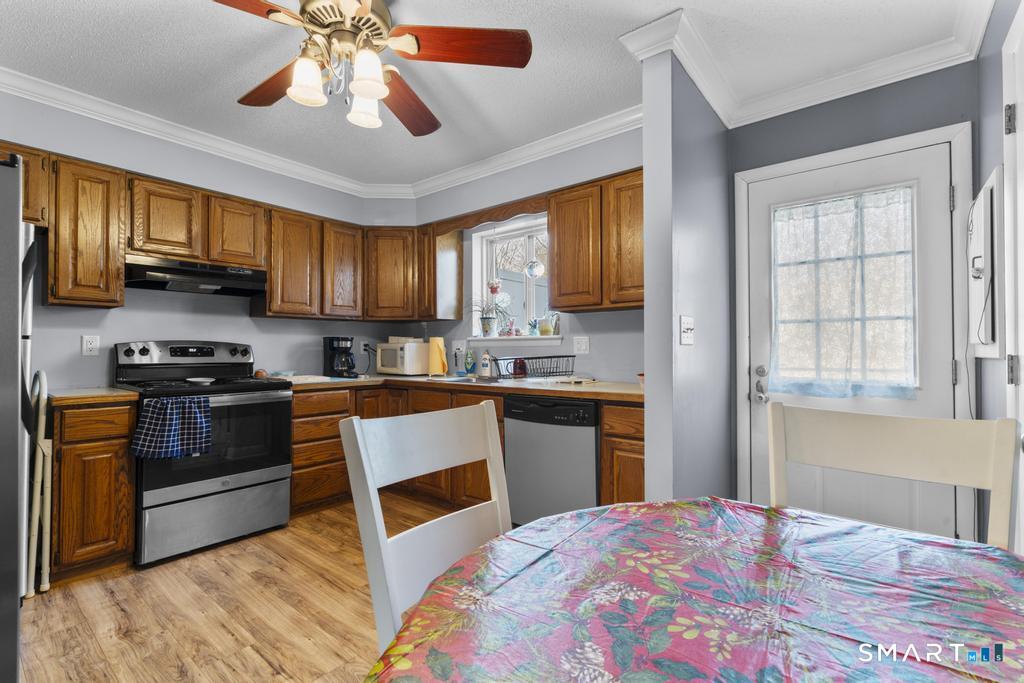 3 MacIntosh Lane, Unit 3 Ansonia, CT 06401 - Photo 5 of 34 a kitchen with stainless steel appliances granite countertop a stove a sink and a refrigerator