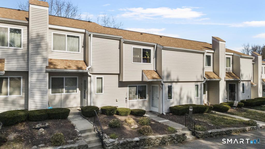 3 MacIntosh Lane, Unit 3 Ansonia, CT 06401 - Photo 9 of 34 a view of a house with a yard