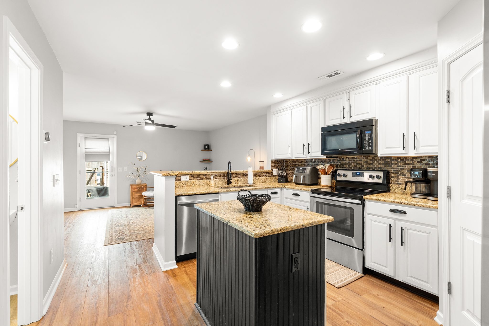 1908 Boxelder Alley Hermitage, TN 37076 - Photo 11 of 31 a kitchen with a sink a counter top space stainless steel appliances and cabinets