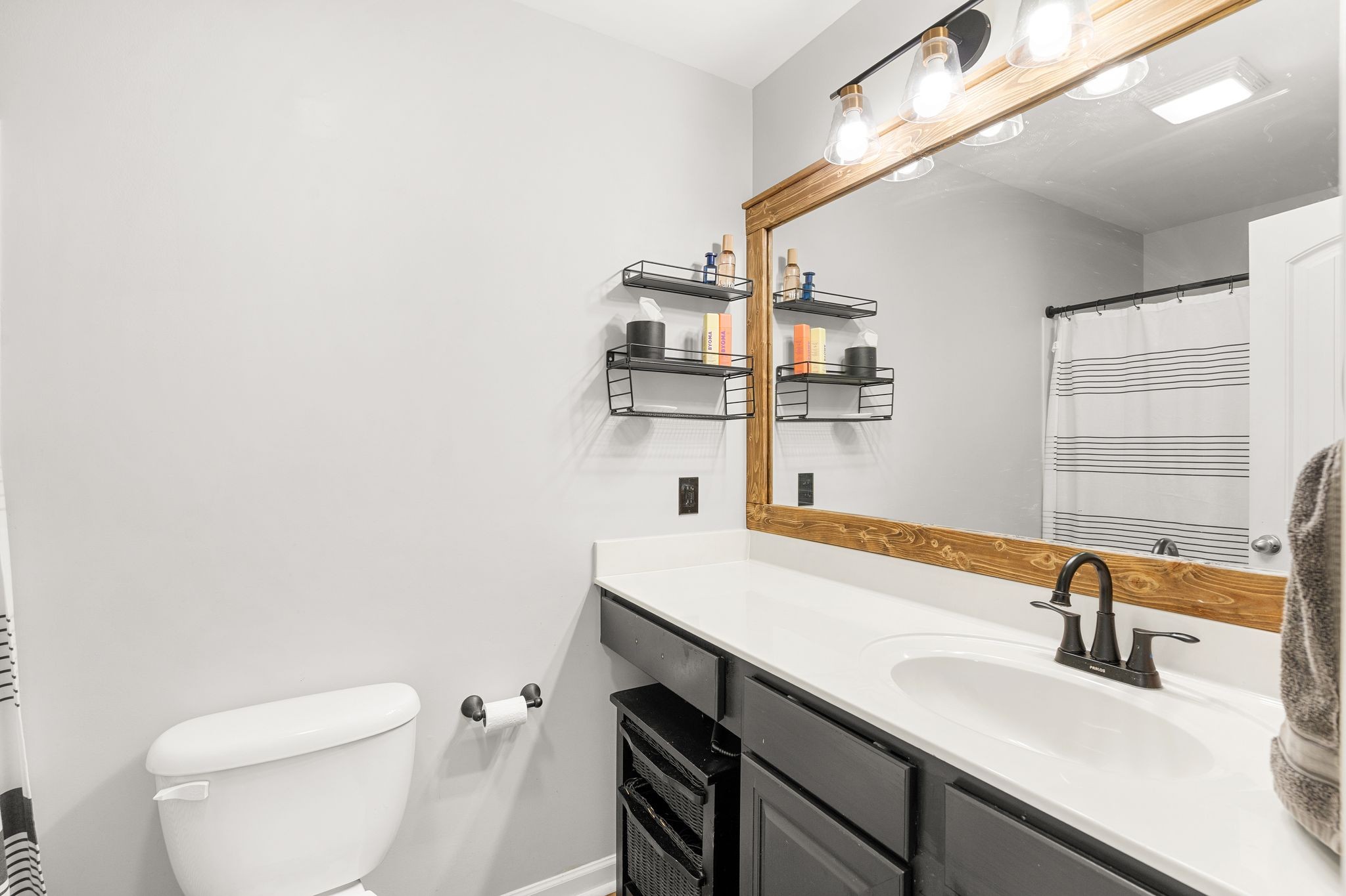 1908 Boxelder Alley Hermitage, TN 37076 - Photo 18 of 31 a bathroom with a sink a toilet and mirror