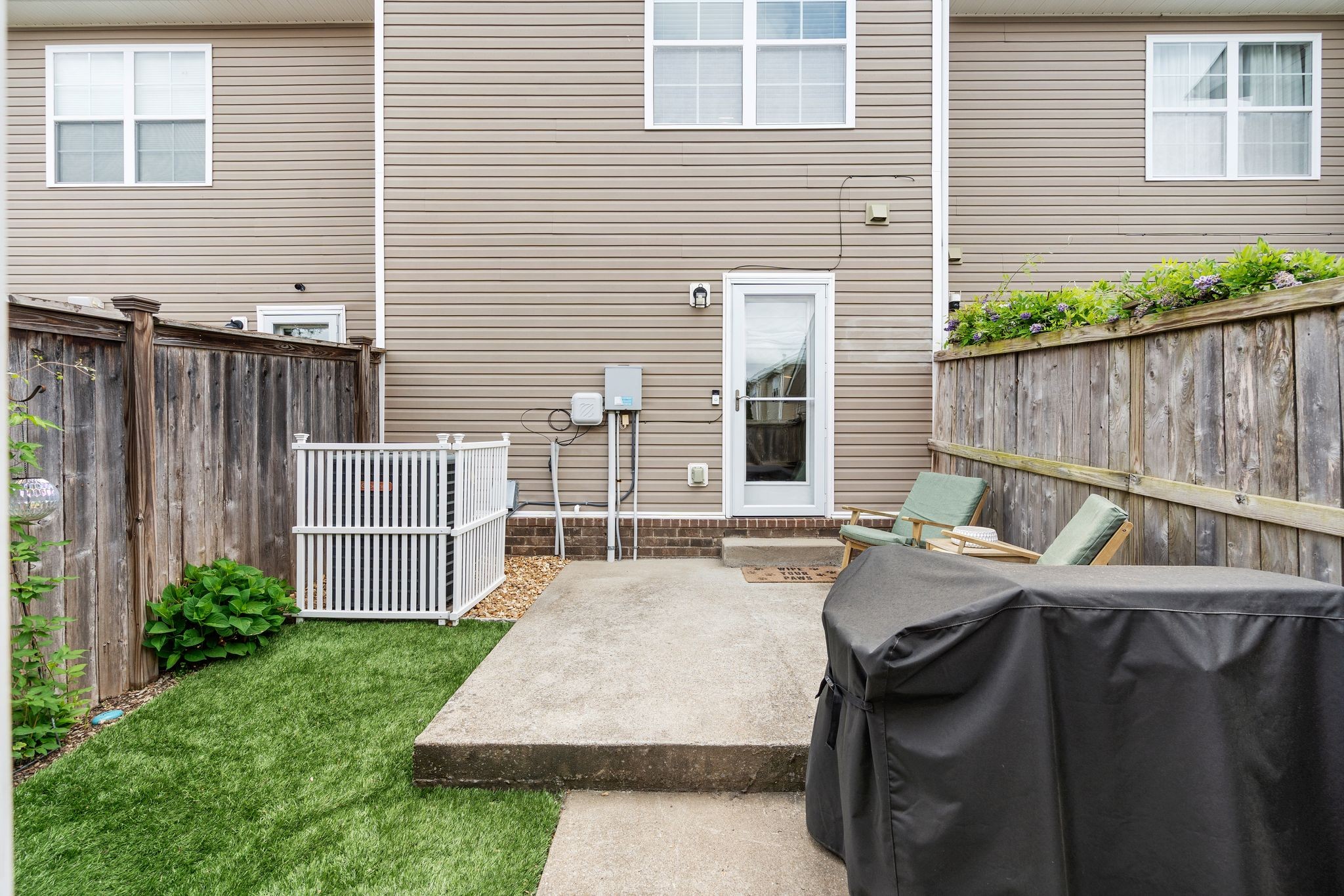 1908 Boxelder Alley Hermitage, TN 37076 - Photo 25 of 31 a patio with table and chairs and potted plants