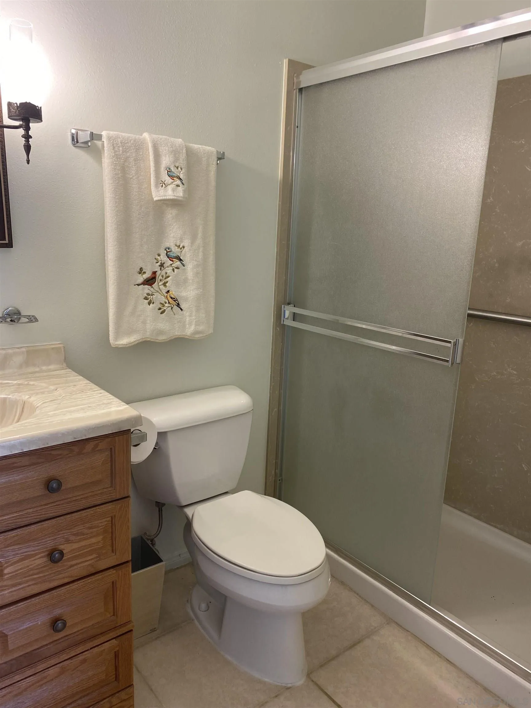 748 Ellen Lane El Cajon, CA 92019 - Photo 14 of 15 a bathroom with a toilet and a shower