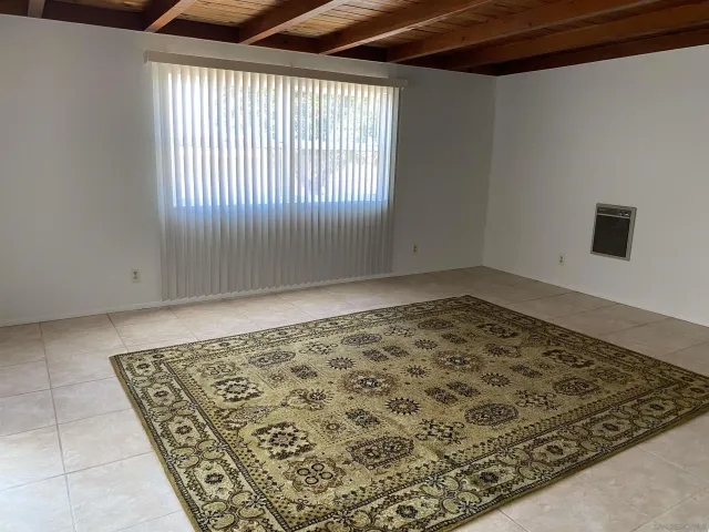 an empty room with wooden floor