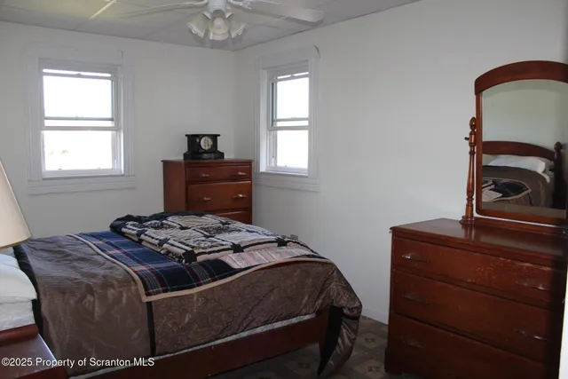 a bedroom with a bed and a dresser