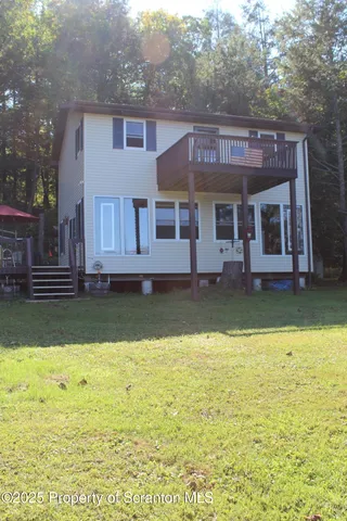 a front view of a house with swimming pool