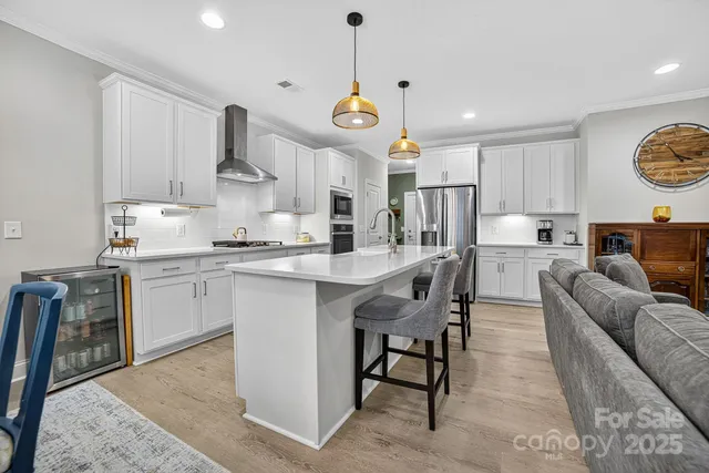 a kitchen with a sink and a stove top oven