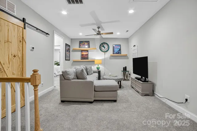 a living room with furniture and a rug