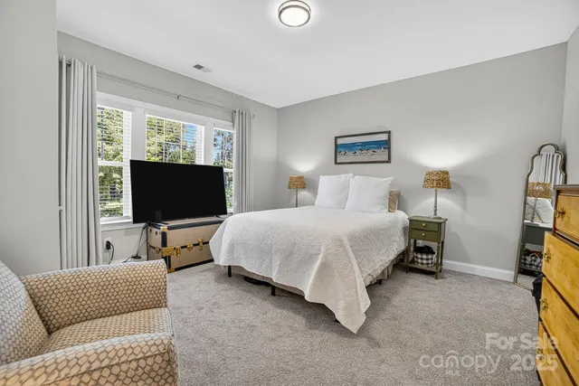 a view of a livingroom with workspace and a couch