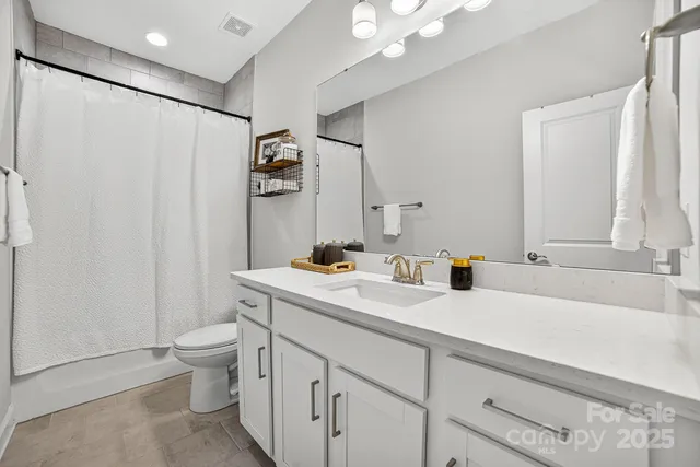 a view of a staircase with white walls and a wooden door