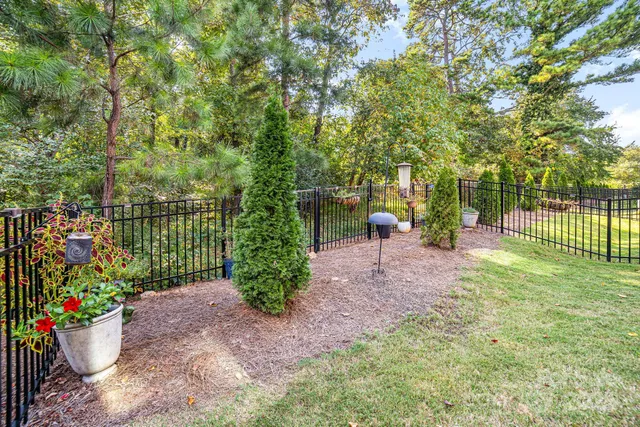 a view of a patio with table and chairs and potted plants