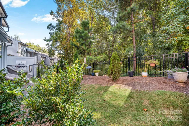 a front view of a house with a yard table and chairs