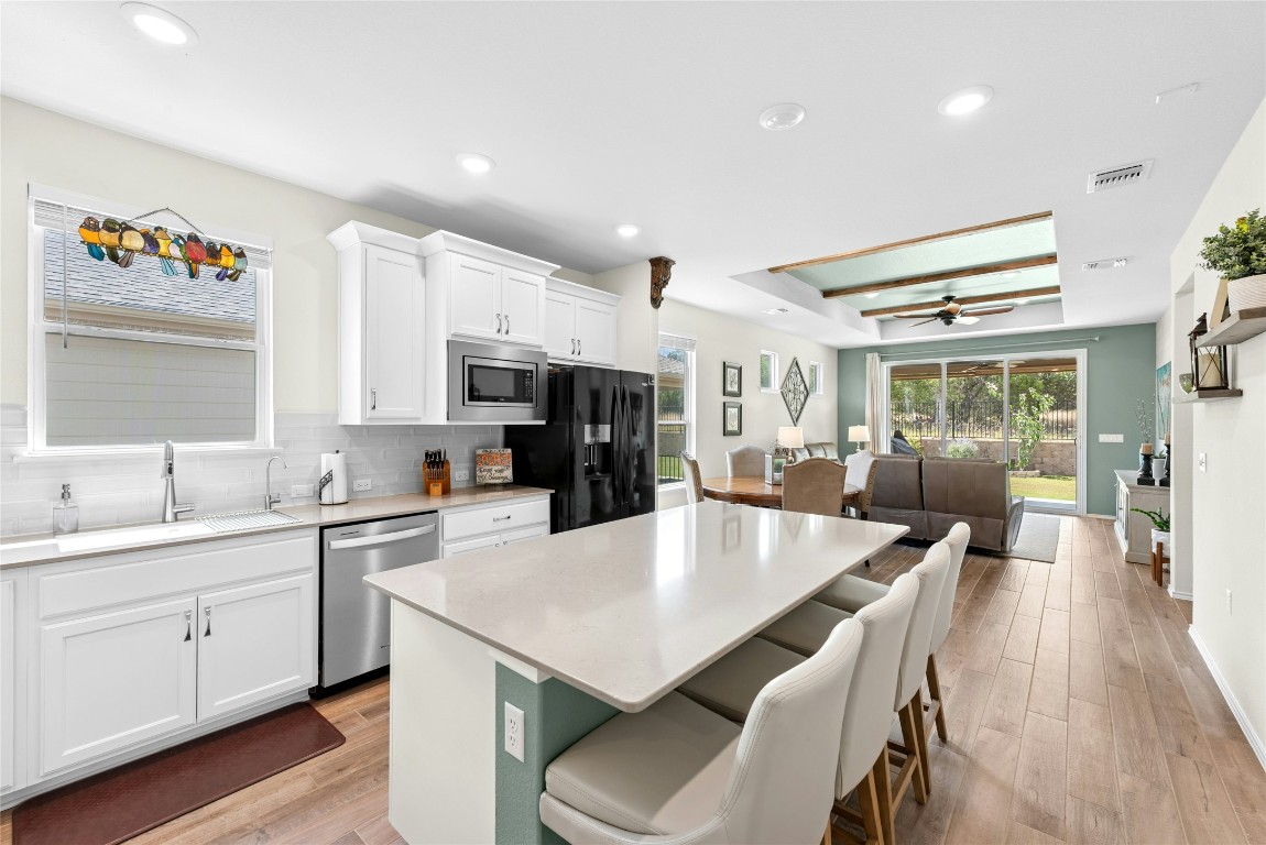 104 Coachsmith Street Georgetown, TX 78633 - Photo 14 of 38 a large kitchen with a table and chairs
