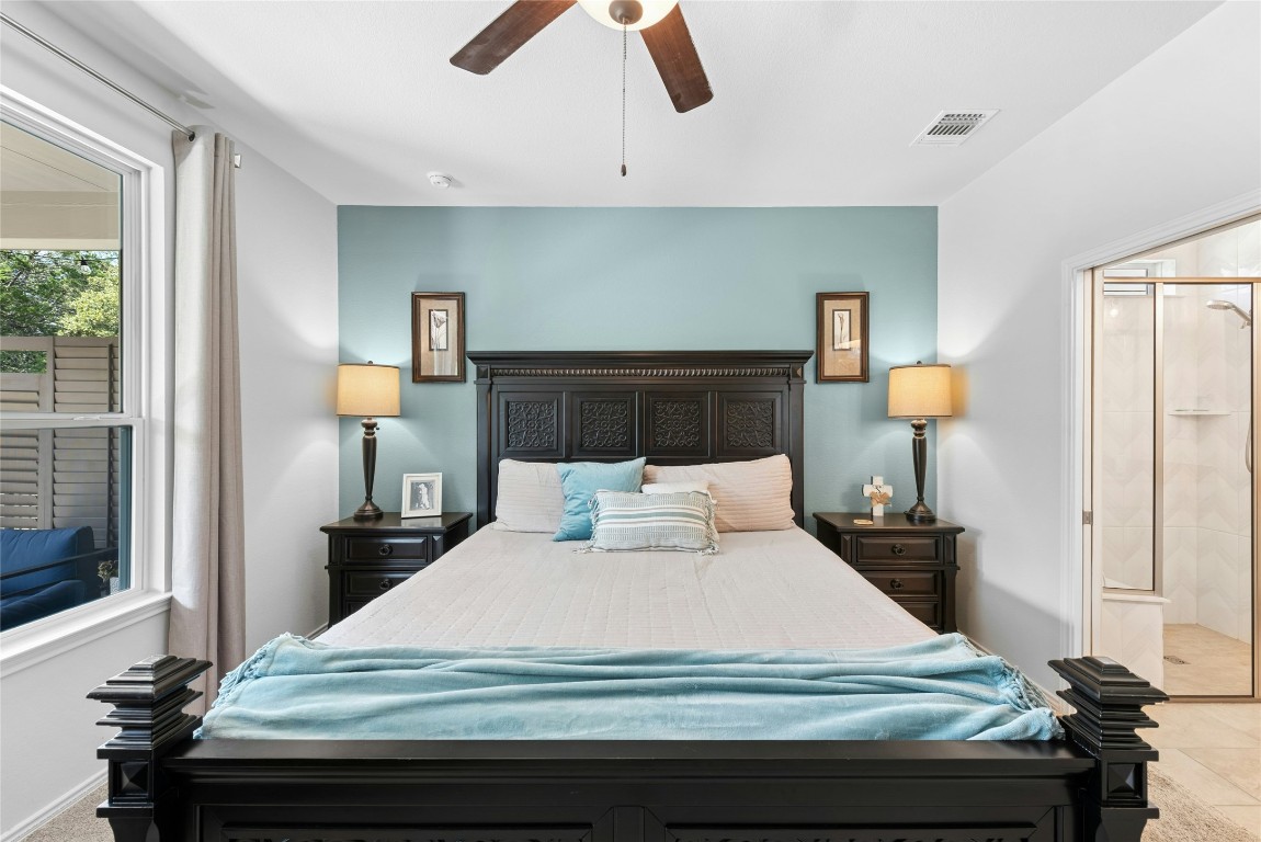 104 Coachsmith Street Georgetown, TX 78633 - Photo 17 of 38 a bedroom with a bed and wooden floor