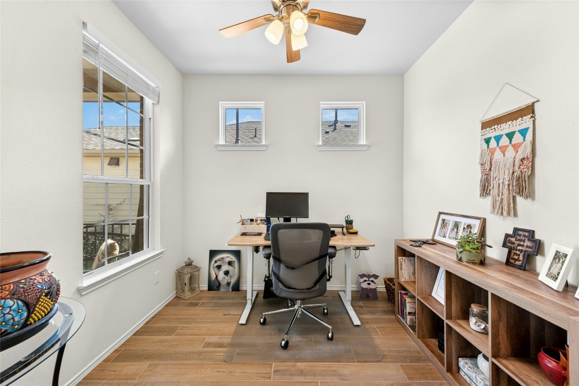 104 Coachsmith Street Georgetown, TX 78633 - Photo 24 of 38 a work room with furniture and windows