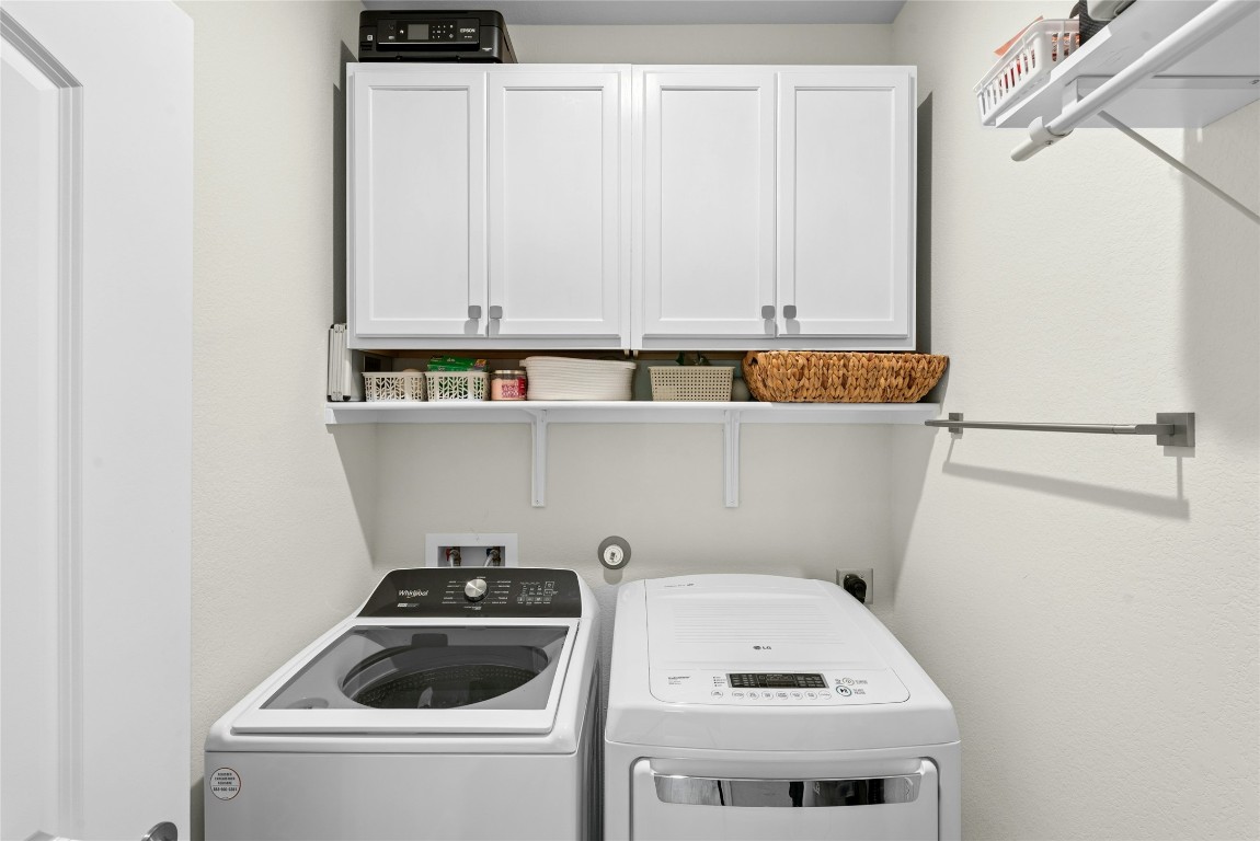 104 Coachsmith Street Georgetown, TX 78633 - Photo 25 of 38 a utility room with dryer and washer