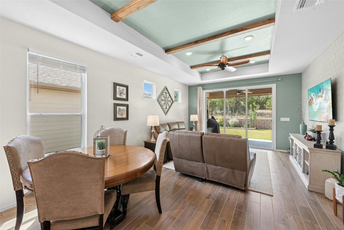 104 Coachsmith Street Georgetown, TX 78633 - Photo 4 of 38 a dining room with furniture a chandelier and wooden floor
