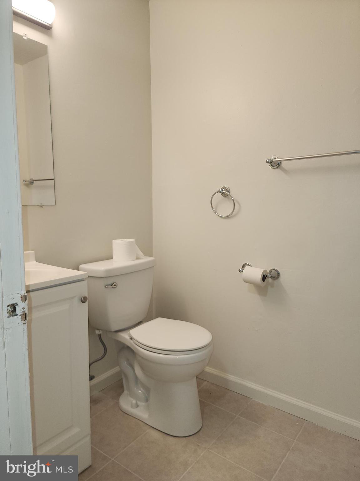 1270 Palmer Road, Unit 92 Fort Washington, MD 20744 - Photo 21 of 24 a white toilet sitting next to a bathroom sink