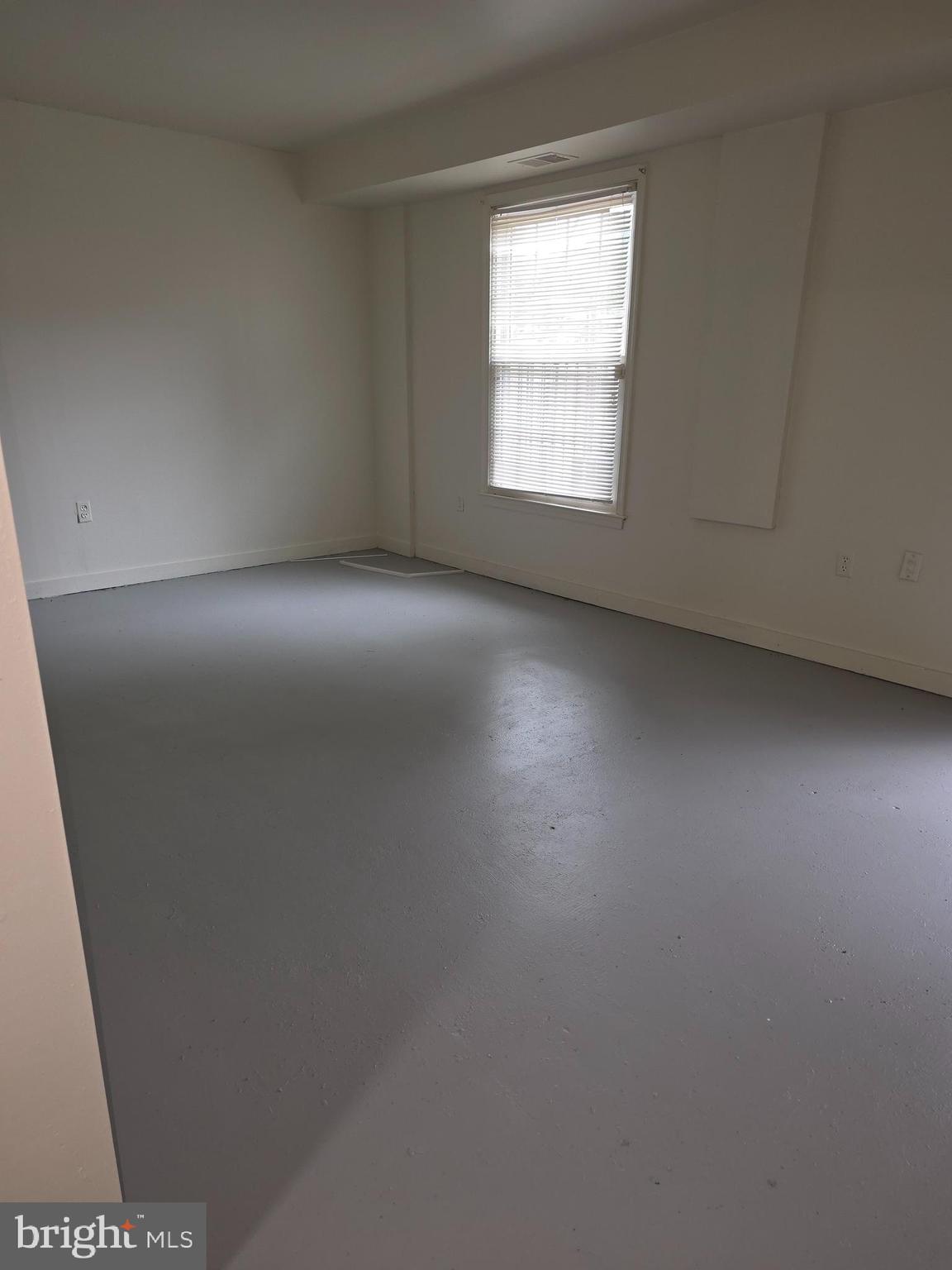 1270 Palmer Road, Unit 92 Fort Washington, MD 20744 - Photo 23 of 24 an empty room with a window