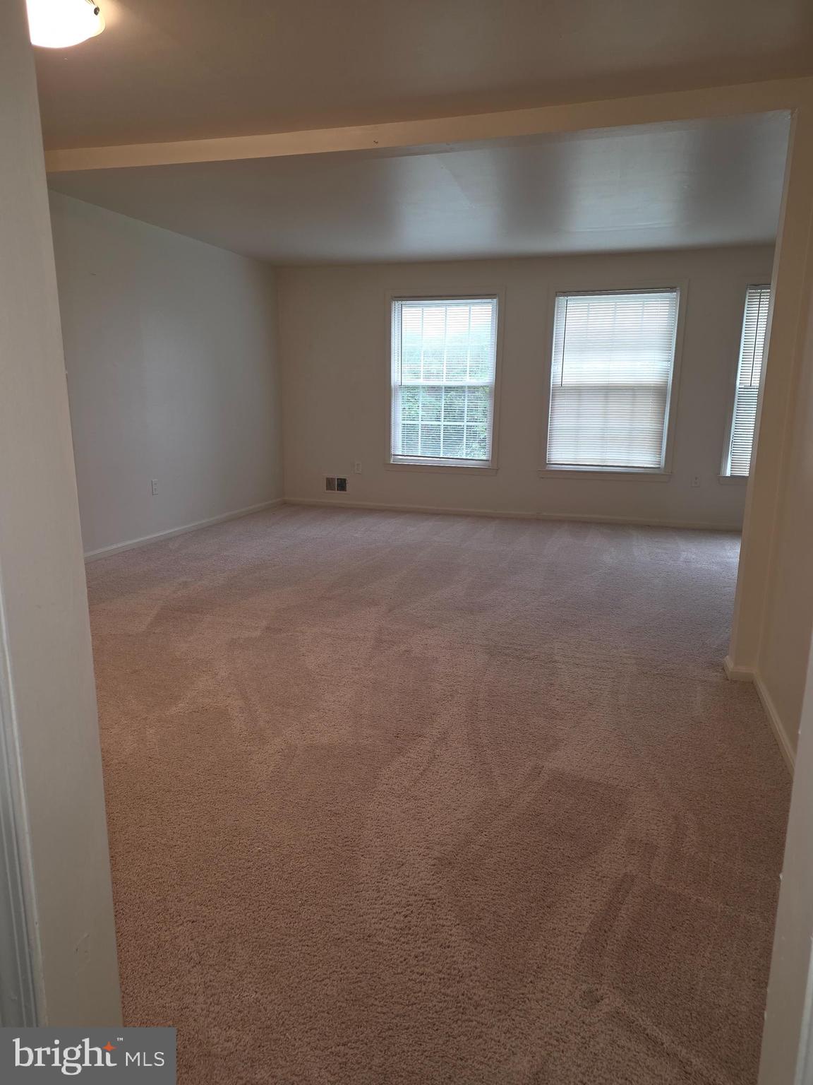 1270 Palmer Road, Unit 92 Fort Washington, MD 20744 - Photo 3 of 24 a view of an empty room with a window