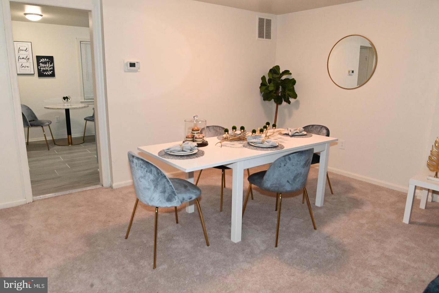 1270 Palmer Road, Unit 92 Fort Washington, MD 20744 - Photo 5 of 24 a view of a dining room with furniture