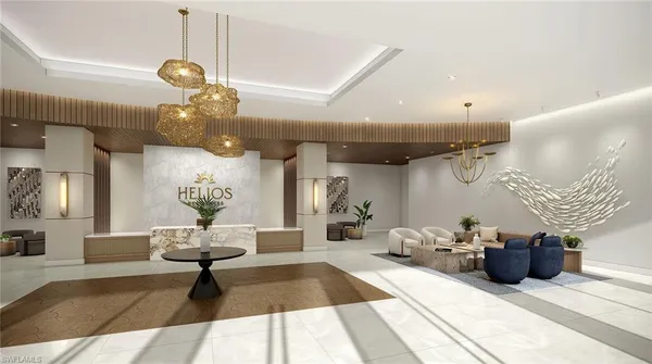 a living room with lots of furniture and view of chandelier
