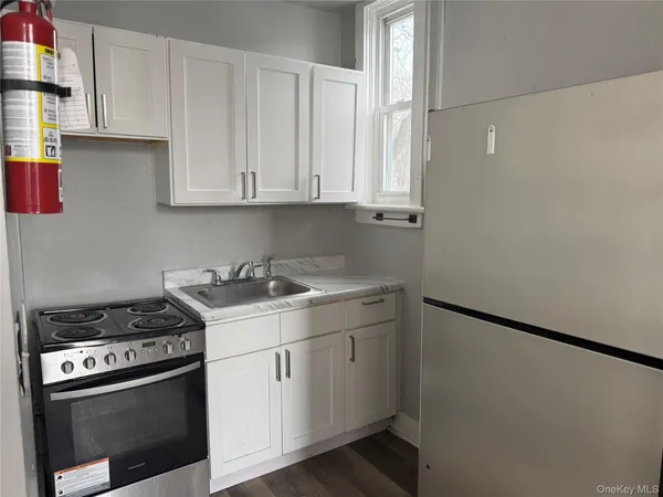 a kitchen with a stove and a refrigerator