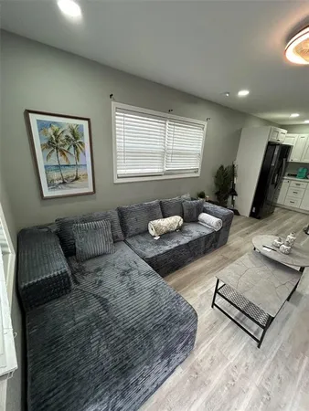 a kitchen with a sink stainless steel appliances and cabinets