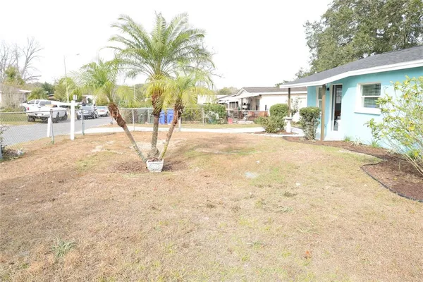 a view of a backyard of the house