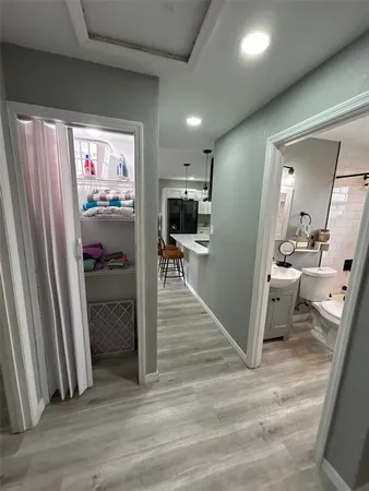 a view of a livingroom from a hallway