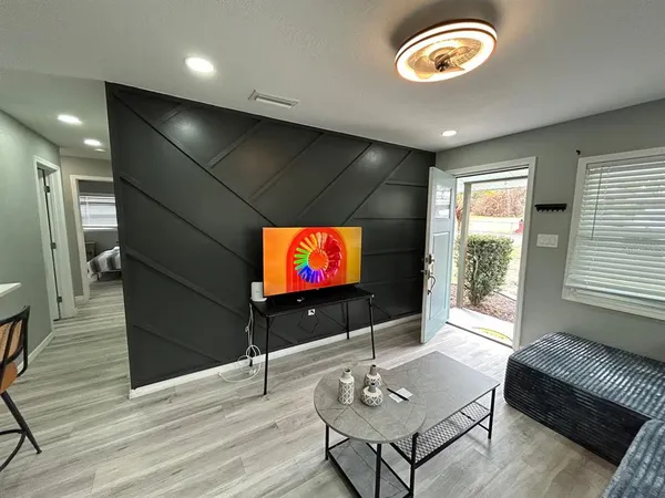 a living room with furniture and a window