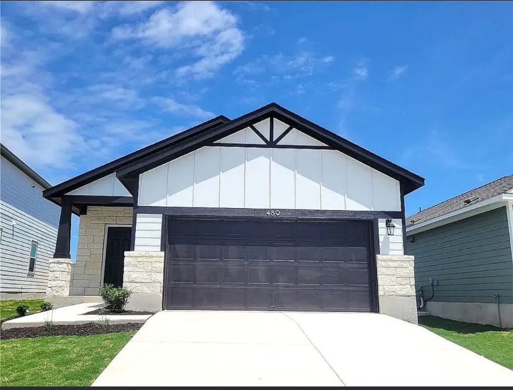 489 Unforgiven Lane Jarrell, TX 76537 - Photo 1 of 9 a front view of a house with a yard