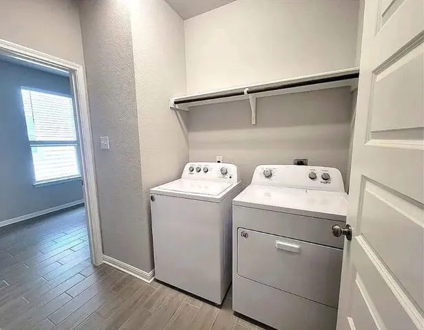 a utility room with dryer and washer