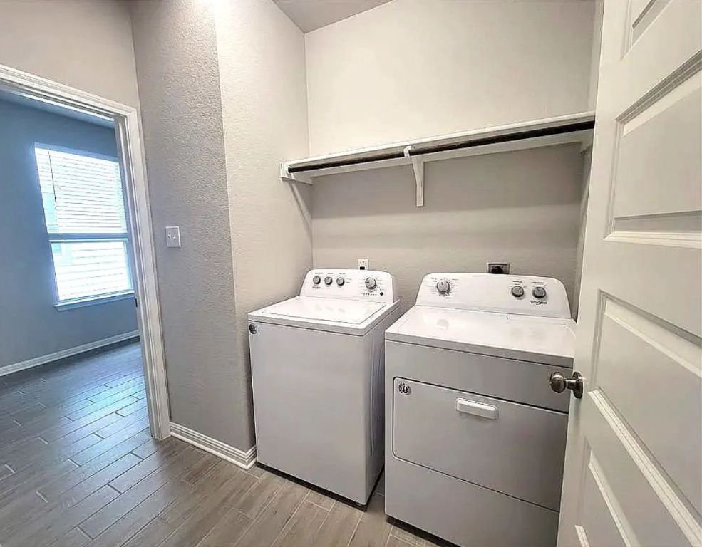 489 Unforgiven Lane Jarrell, TX 76537 - Photo 7 of 9 a utility room with dryer and washer