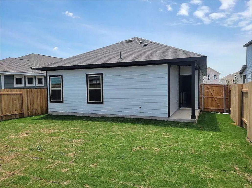 489 Unforgiven Lane Jarrell, TX 76537 - Photo 9 of 9 a backyard of a house with lots of green space