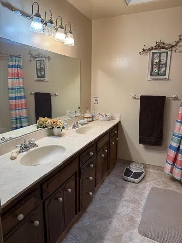 a spacious bedroom with a bed and a window