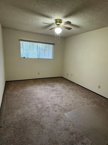 a spacious bathroom with a double vanity sink and a mirror