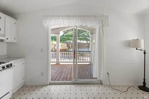 a kitchen with white cabinets and a sink