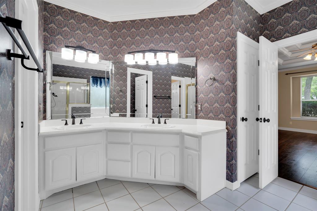 1907 Timber Ridge Court Cedar Hill, TX 75104 - Photo 14 of 30 Dual vanity with white cabinetry, integrated sinks, white countertops, and black hardware