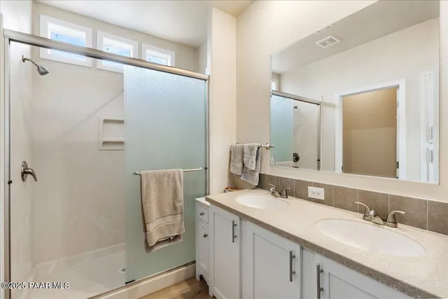 a bathroom with a sink and mirror
