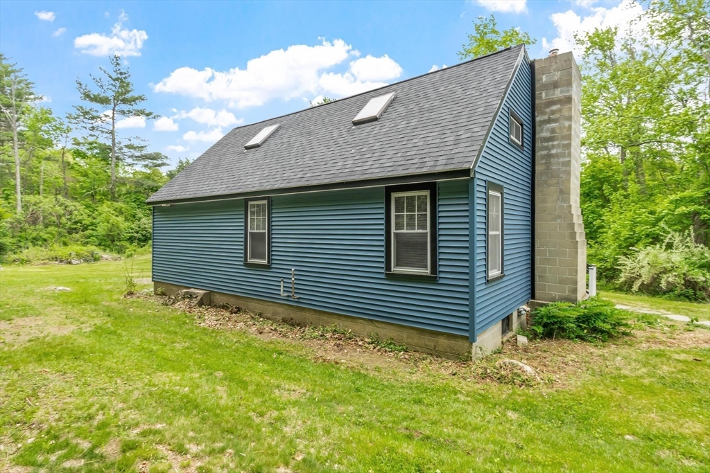 258 Allen Road Ashby, MA 01431 - Photo 36 of 36 a front view of a house with garden