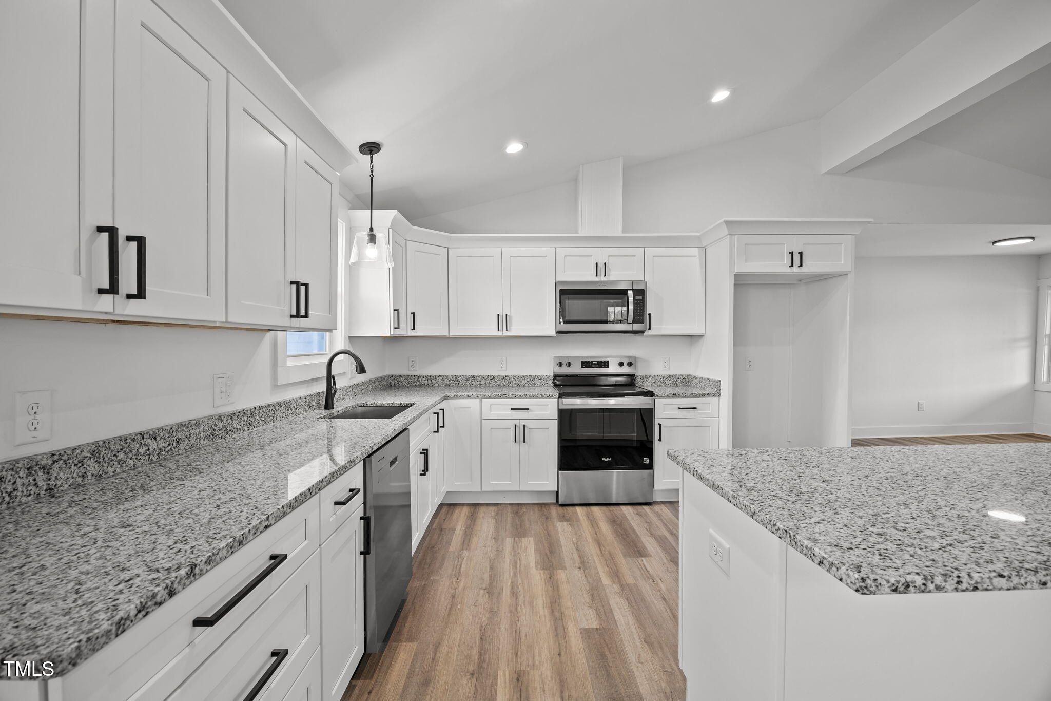 1161 Stewart Road Dunn, NC 28334 - Photo 15 of 50 a kitchen with kitchen island granite countertop a sink stove and refrigerator