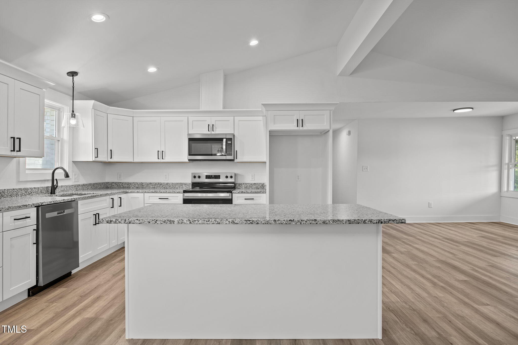 1161 Stewart Road Dunn, NC 28334 - Photo 17 of 50 a kitchen with stainless steel appliances granite countertop a sink a stove a refrigerator and white cabinets