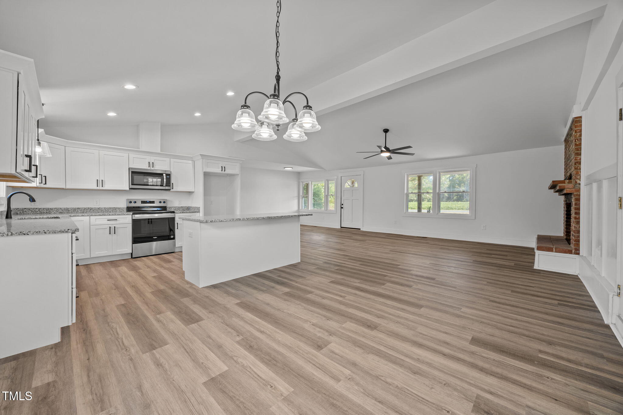 1161 Stewart Road Dunn, NC 28334 - Photo 18 of 50 a view of a kitchen with a sink stainless steel appliances and cabinets
